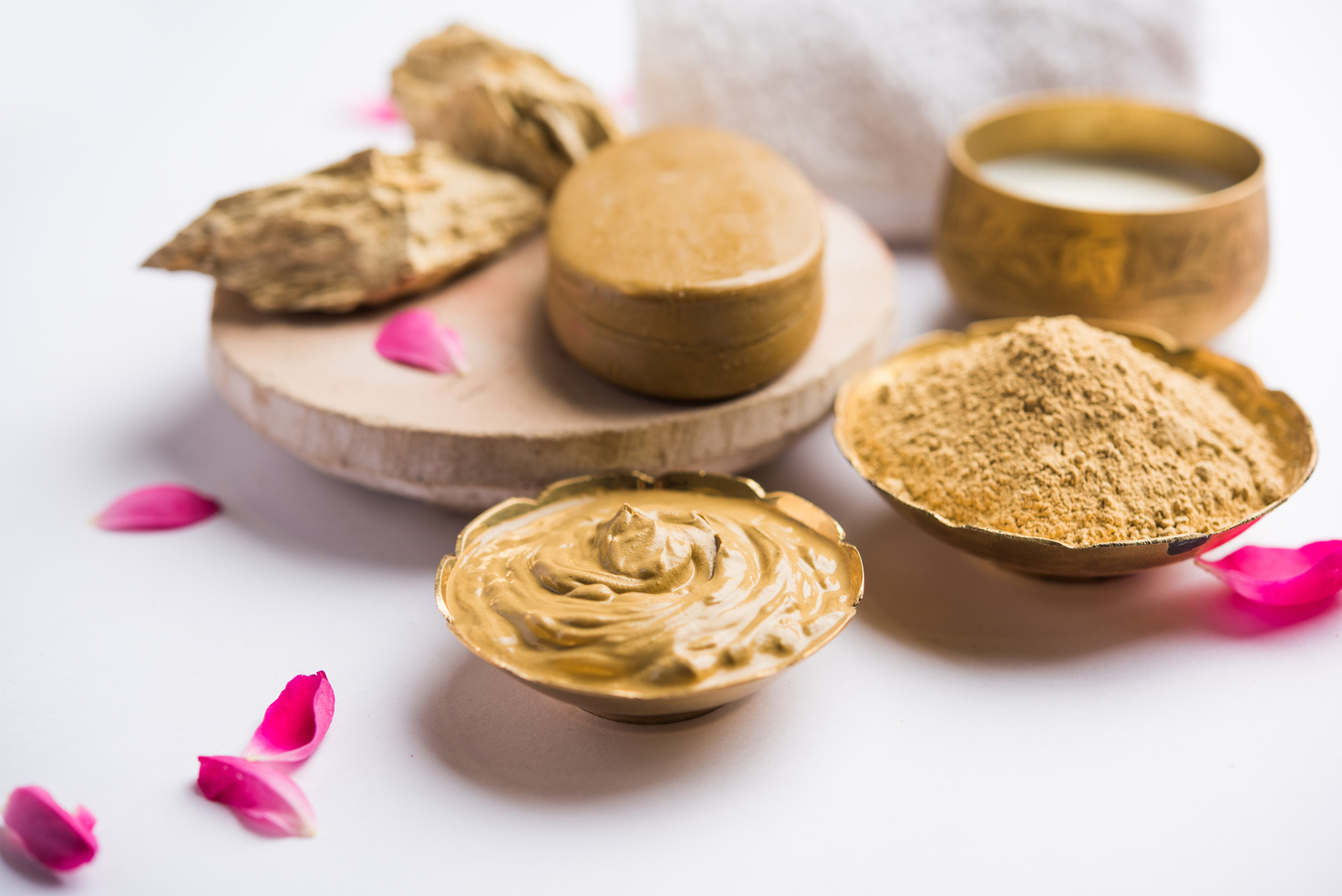 Herbal or Ayurvedic face Pack using Multani mitti, milk etc placed with Soap, towel. Selective focus